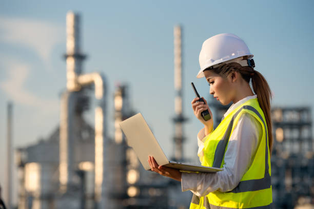 Engineer inspecting in industrial oil refinery. Industry 4.0 concept. Background blurred concept.